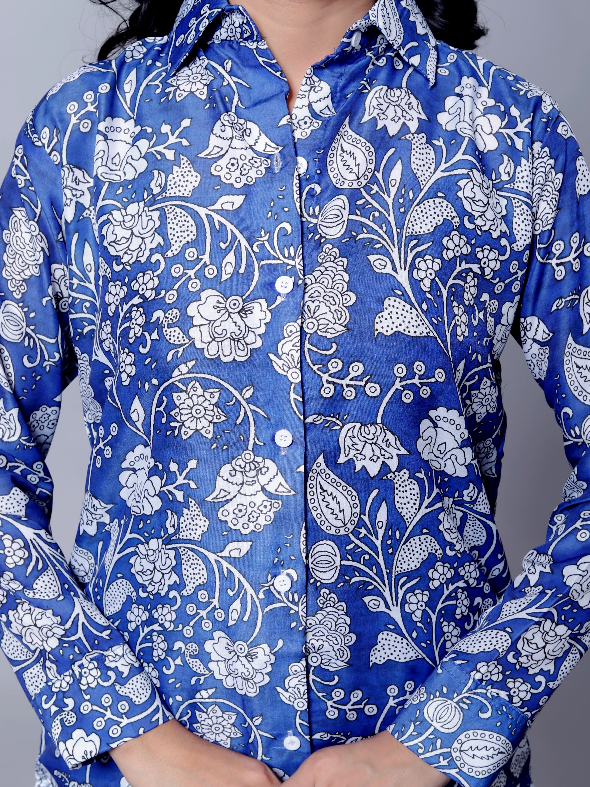 Close-up of Blue Floral Textured Crop Shirt with Collar and Long Sleeves